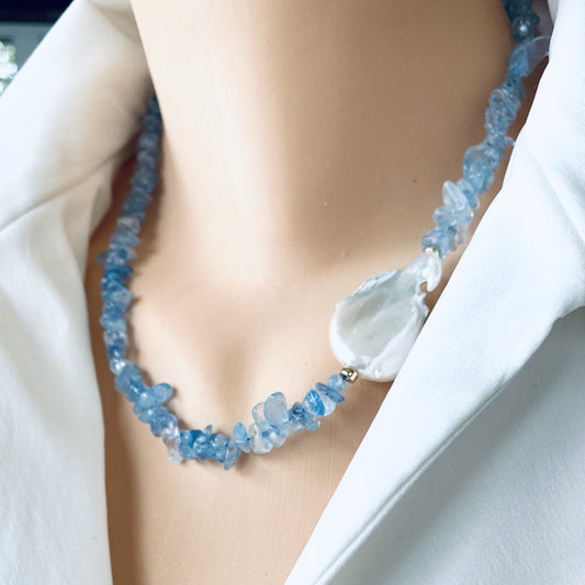 Aquamarine pearl necklace worn at the neckline with aquamarine chips and flat baroque pearl