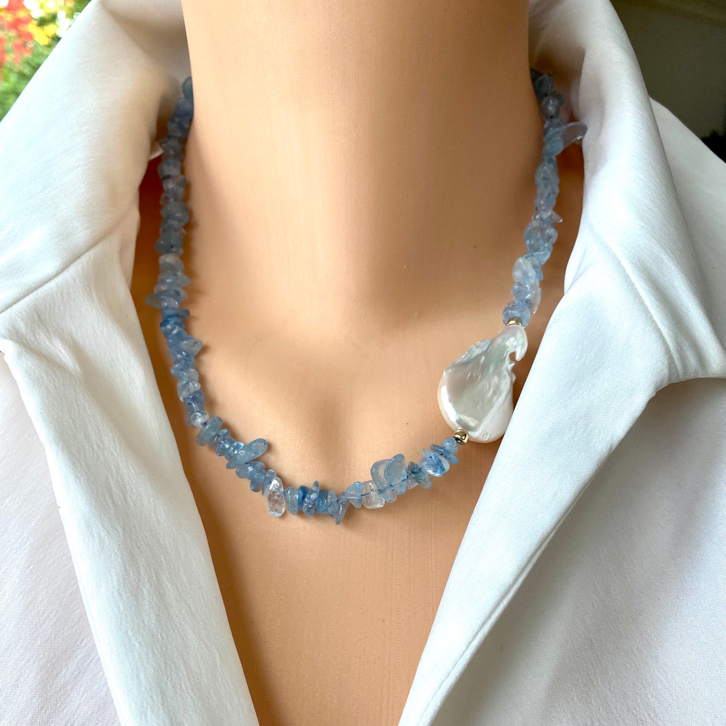 Aquamarine pearl necklace close up showing aquamarine beads and asymmetrical pearl placement