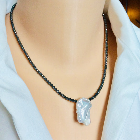 Hematite baroque pearl short necklace worn alone showing single pearl focal point