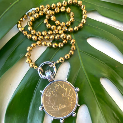 Elevate your style with this stunning Gold Faceted Hematite Beads 8mm and Repro Mexican Peso Coin Pendant Necklace. Featuring a unique Horse Coin Equestrian Pendant, this 28-inch hand-knotted necklace is the perfect piece to add to your collection.