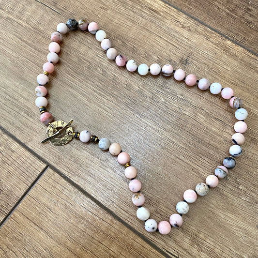 Pink opal hematite necklace with hand knotted pink opal beads and gold bronze toggle clasp