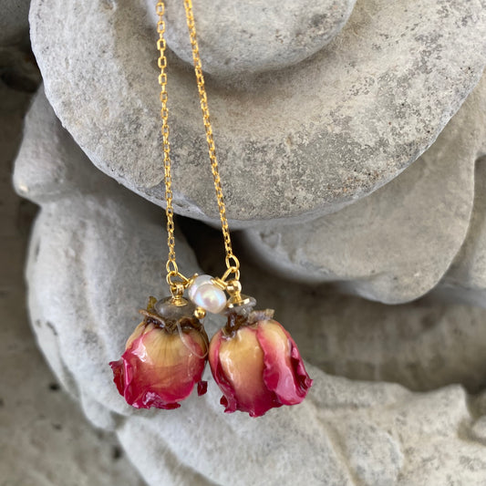 Pearl threader earrings featuring real red roses and freshwater pearls, showcasing a romantic and elegant design.