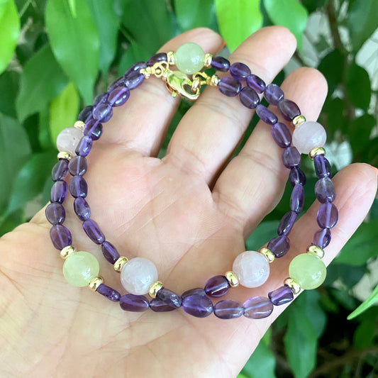 Amethyst bonbons necklace with amethyst nuggets and mixed gemstone beads held in hand, handmade Canadian jewelry