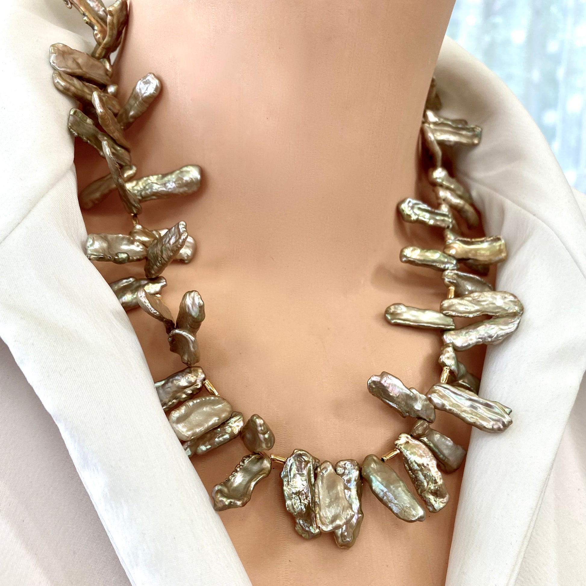 Champagne pearl necklace worn on model, Biwa keshi stick pearls with warm champagne iridescence