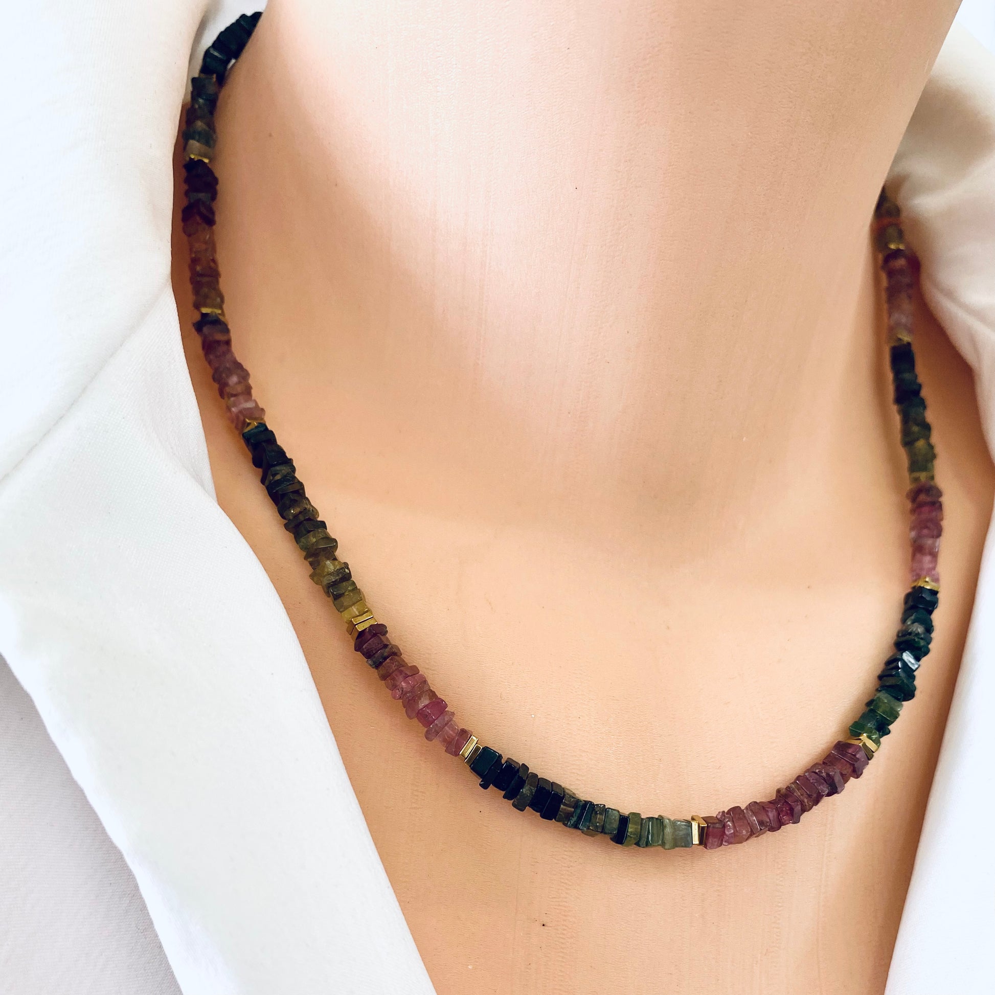 Tourmaline Necklace 14k Gold Filled on model, watermelon tourmaline and gold hematite heishi beads