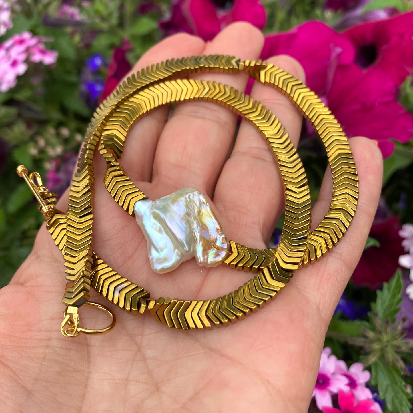 Gold hematite keshi pearl necklace close-up showing organic square keshi pearl focal point