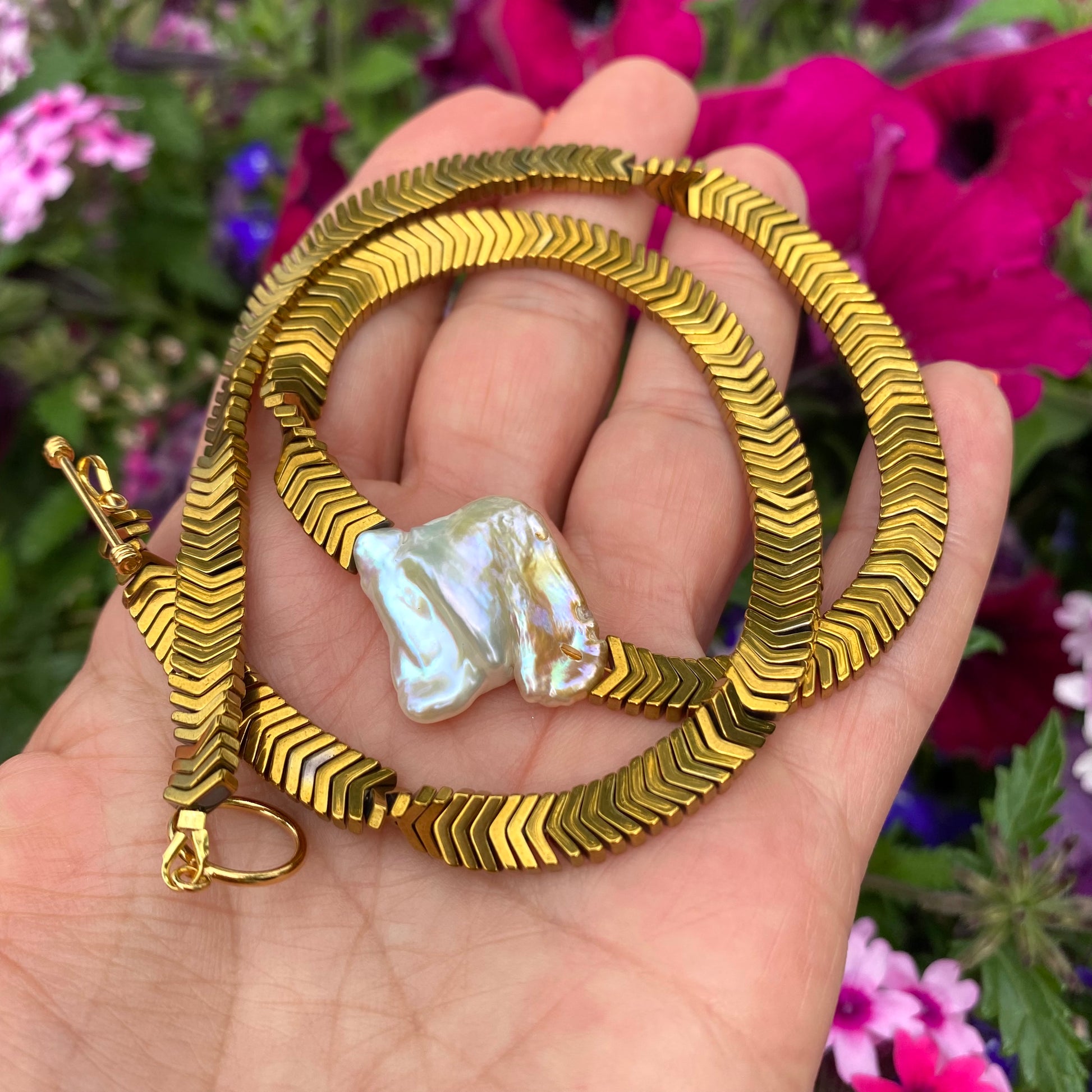 Gold hematite keshi pearl necklace close-up showing organic square keshi pearl focal point