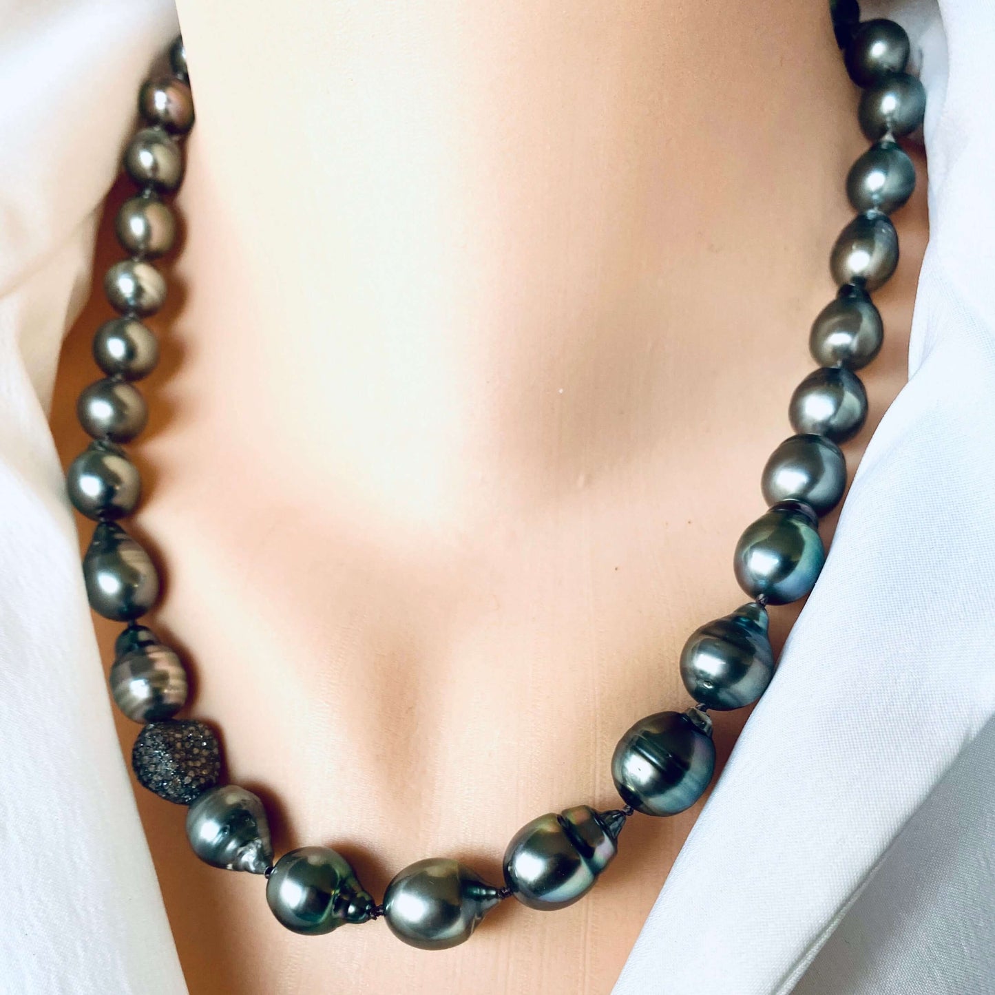 Tahitian baroque pearl necklace with champagne diamonds on a mannequin, showcasing its elegant design.