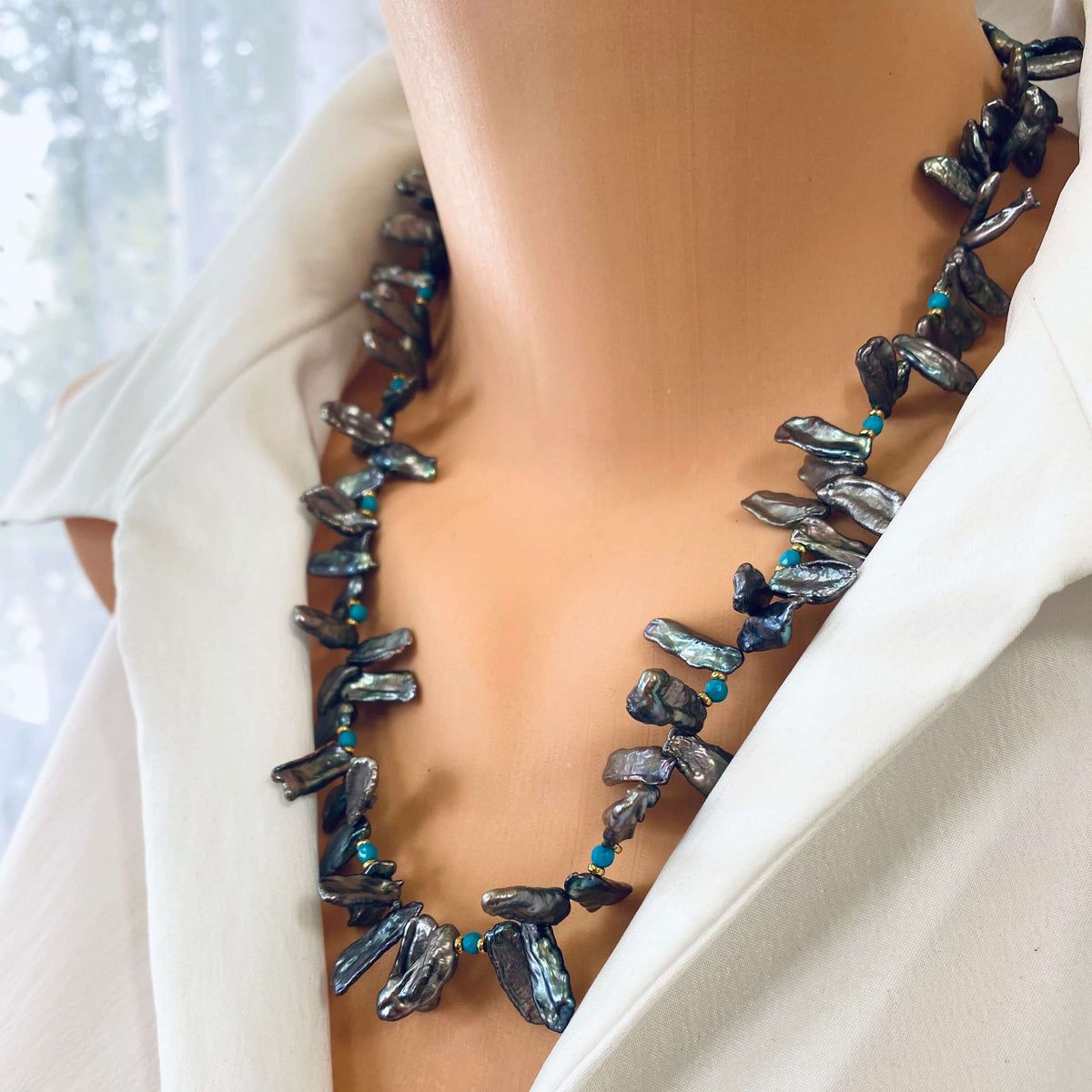 Biwa pearl turquoise necklace on model close-up, organic Biwa pearls with blue turquoise details