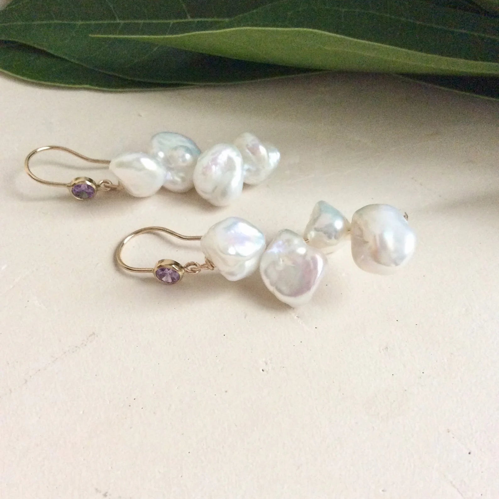 Keshi Pearl Drop Earrings – 14k Gold Filled with Purple CZ and white freshwater keshi pearls, handmade in Canada.