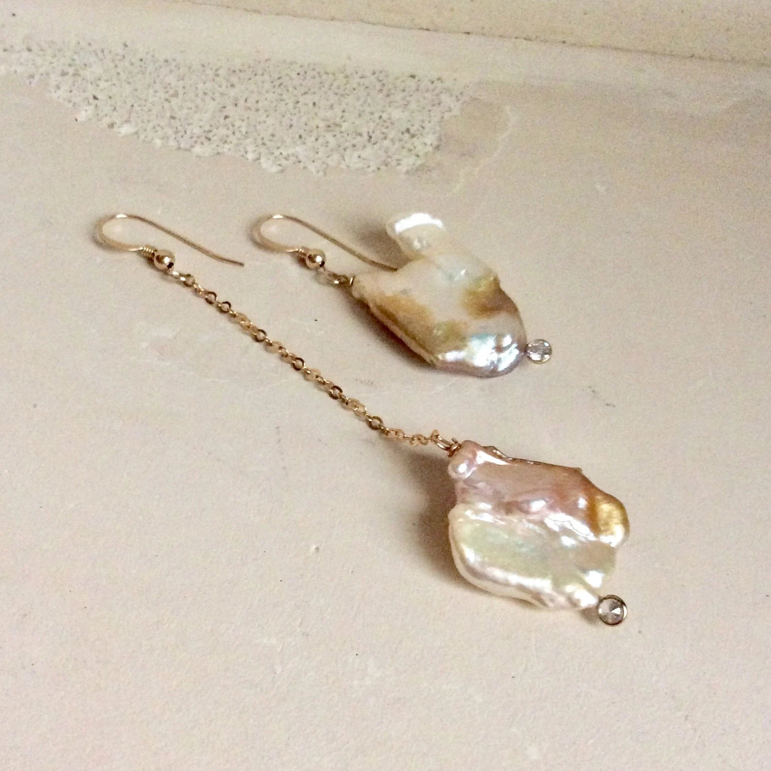 Mismatched Pearl Drop Earrings featuring asymmetrical pearls with clear CZ, 14k gold filled detail.